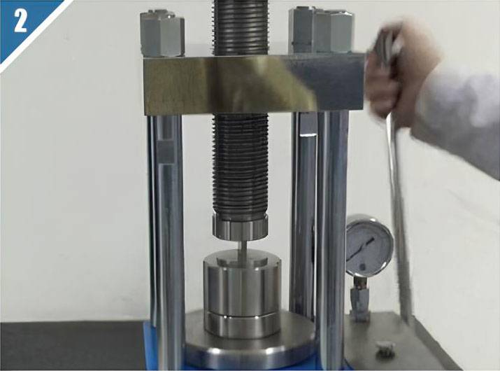 Step 2: Place the die in the hydraulic press and apply pressure.