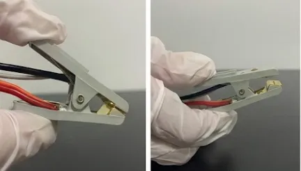 Handgehaltener Batterieclip