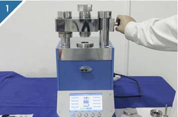 1. Open the cantilever of the tablet press.